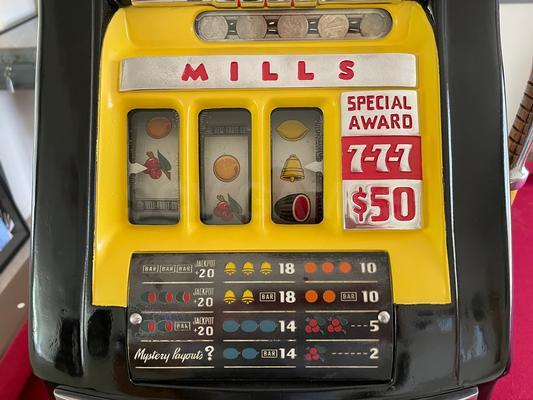 1940's Mills High Top 777 Bell 25 Cent Slot Machine Image