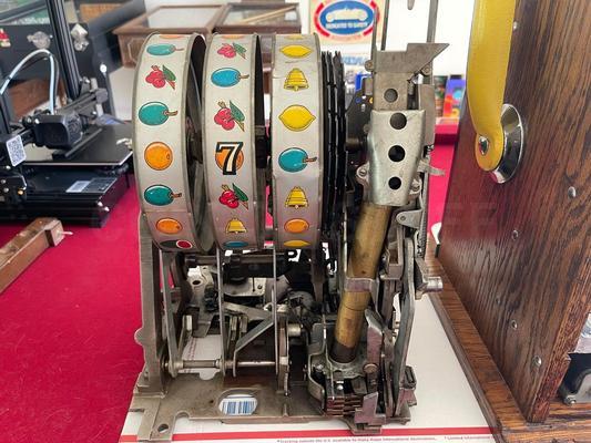 1940's Mills High Top 777 Bell 25 Cent Slot Machine Image